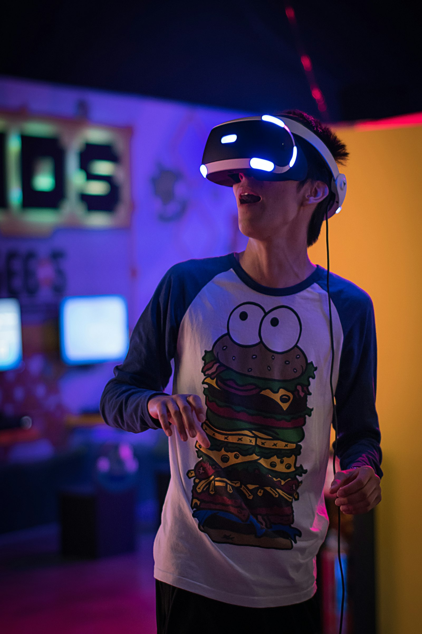A person wearing a headset in a small workspace